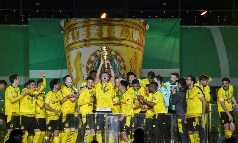 Erling Braut Haaland lifts the trophy after Dortmund won the German Cup final on Thursday