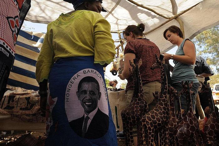 Photo made January 18, 2009 shows tourists shopping in a stall selling 'Obama' merchandise at Nyang'oma village, Kogelo, during festivities to celebrate the anticipated inauguration of America's President elect, Barack Obama. TONY KARUMBA/AFP via Getty...