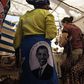 Photo made January 18, 2009 shows tourists shopping in a stall selling 'Obama' merchandise at Nyang'oma village, Kogelo, during festivities to celebrate the anticipated inauguration of America's President elect, Barack Obama. TONY KARUMBA/AFP via Getty...