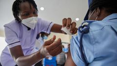 Woman getting vaccinated in Kenya