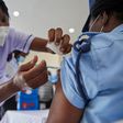 Woman getting vaccinated in Kenya