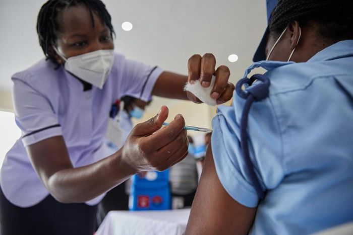Woman getting vaccinated in Kenya