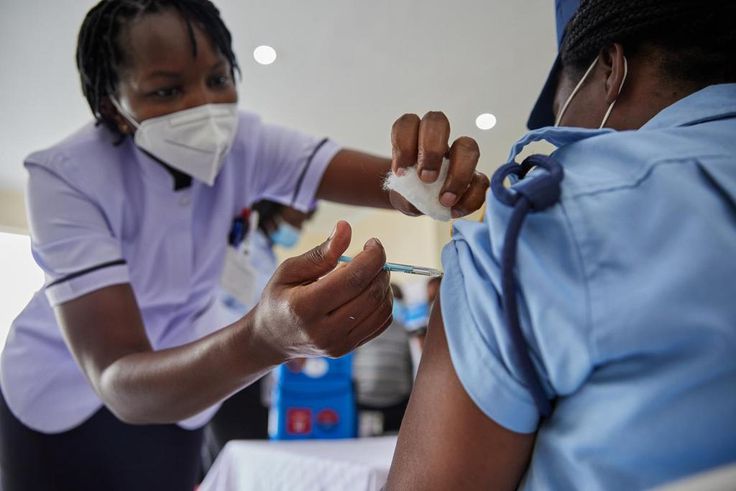 Woman getting vaccinated in Kenya