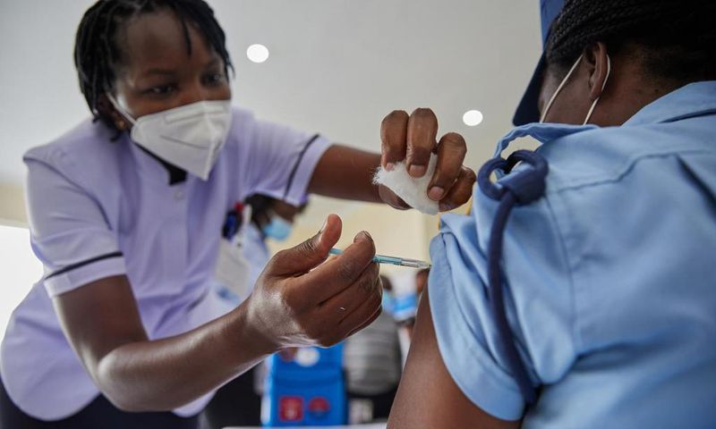Woman getting vaccinated in Kenya