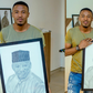 Alikiba in tears as fan surprises him with a portrait of his late Father (Video)