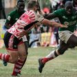 {FILE PHOTO} Alvin Otieno Ochieng (R) of Kenya's national team Shujaa blocks Ruan Mostert of Samurai RFC during the final of Safari Sevens, Kenya's annual rugby sevens tournament with professional and amature teams, in Nairobi, Kenya, on November 11, 2...