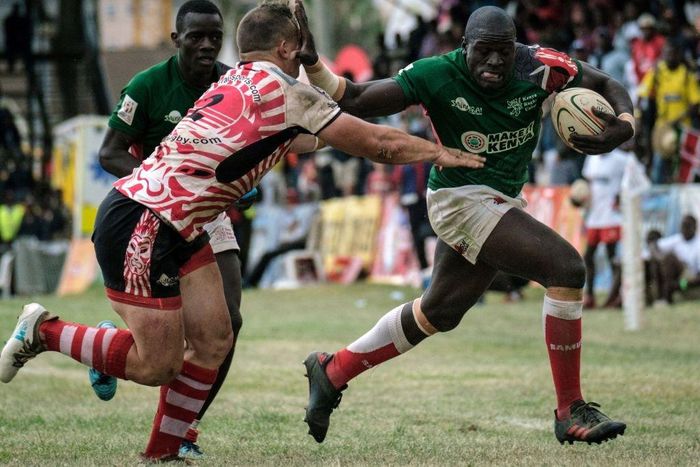 {FILE PHOTO} Alvin Otieno Ochieng (R) of Kenya's national team Shujaa blocks Ruan Mostert of Samurai RFC during the final of Safari Sevens, Kenya's annual rugby sevens tournament with professional and amature teams, in Nairobi, Kenya, on November 11, 2...