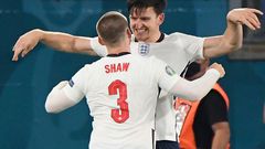 On my head son: Harry Maguire (top) was set up by Luke Shaw (bottom) for England's second goal against Ukraine