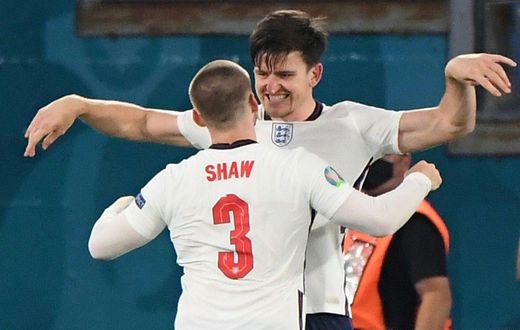 On my head son: Harry Maguire (top) was set up by Luke Shaw (bottom) for England's second goal against Ukraine