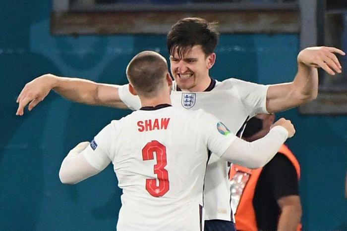 On my head son: Harry Maguire (top) was set up by Luke Shaw (bottom) for England's second goal against Ukraine