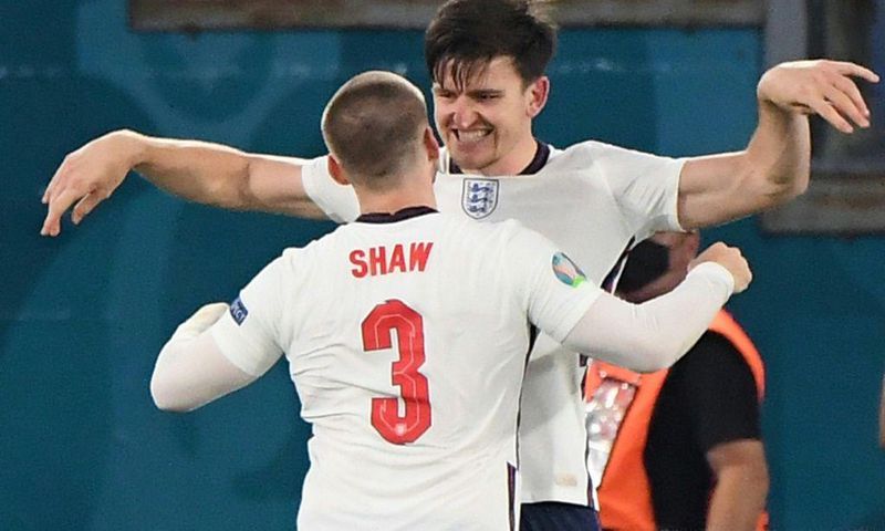 On my head son: Harry Maguire (top) was set up by Luke Shaw (bottom) for England's second goal against Ukraine