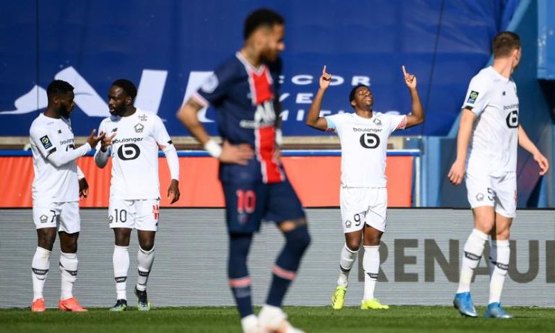 Lille forward Jonathan David (2R) celebrates after scoring his team's winner against Ligue 1 title rivals PSG last weekend