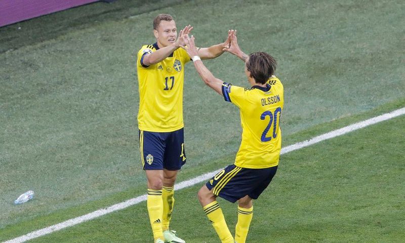 Viktor Claesson (L) celebrates his late winner against Poland