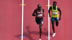 Kenya's Ferguson Cheruiyot Rotich (L) and Australia's Peter Bol compete in the men's 800m heats during the Tokyo 2020 Olympic Games at the Olympic Stadium in Tokyo on July 31, 2021. (Photo by Antonin THUILLIER / AFP) (Photo by ANTONIN THUILLIER/AFP via...