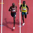 Kenya's Ferguson Cheruiyot Rotich (L) and Australia's Peter Bol compete in the men's 800m heats during the Tokyo 2020 Olympic Games at the Olympic Stadium in Tokyo on July 31, 2021. (Photo by Antonin THUILLIER / AFP) (Photo by ANTONIN THUILLIER/AFP via...