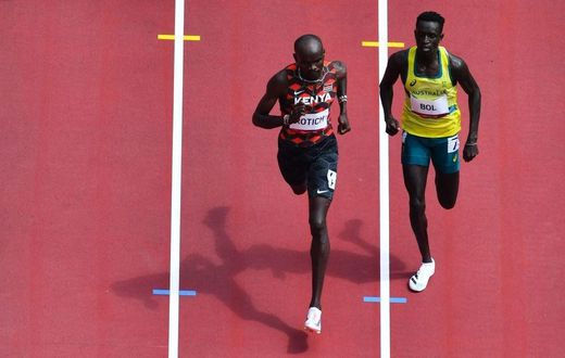 Kenya's Ferguson Cheruiyot Rotich (L) and Australia's Peter Bol compete in the men's 800m heats during the Tokyo 2020 Olympic Games at the Olympic Stadium in Tokyo on July 31, 2021. (Photo by Antonin THUILLIER / AFP) (Photo by ANTONIN THUILLIER/AFP via...