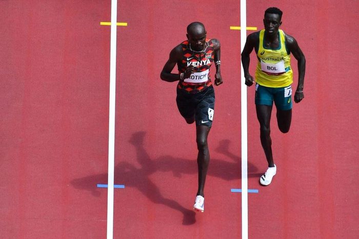 Kenya's Ferguson Cheruiyot Rotich (L) and Australia's Peter Bol compete in the men's 800m heats during the Tokyo 2020 Olympic Games at the Olympic Stadium in Tokyo on July 31, 2021. (Photo by Antonin THUILLIER / AFP) (Photo by ANTONIN THUILLIER/AFP via...