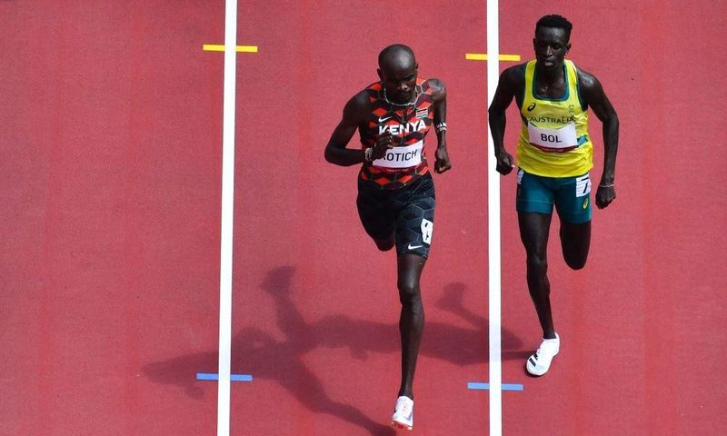 Kenya's Ferguson Cheruiyot Rotich (L) and Australia's Peter Bol compete in the men's 800m heats during the Tokyo 2020 Olympic Games at the Olympic Stadium in Tokyo on July 31, 2021. (Photo by Antonin THUILLIER / AFP) (Photo by ANTONIN THUILLIER/AFP via...