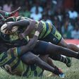 TOPSHOT - Kabras Sugar's Johnston Mungau (C) is tuckled by Kenya Commercial Bank's Brian Omondi (L) and Peter Kilonzo during the Kenya Cup's final match between Kenya Commercial Bank and Kabras Sugar at the KCB Sports Club in Nairobi, on March 24, 2018...