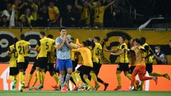 Harry Maguire walks away as Young Boys celebrate their last-gasp winner in Bern