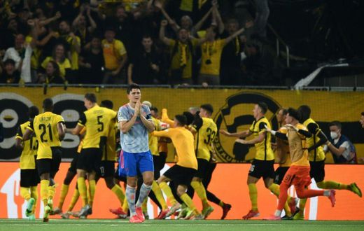 Harry Maguire walks away as Young Boys celebrate their last-gasp winner in Bern