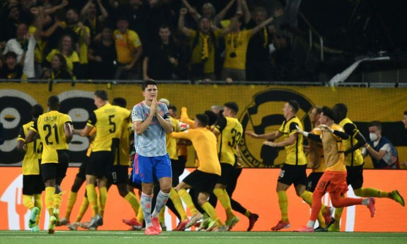Harry Maguire walks away as Young Boys celebrate their last-gasp winner in Bern