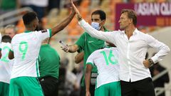 High-five for Saudi scorer Firas al-Buraikan from coach Herve Renard
