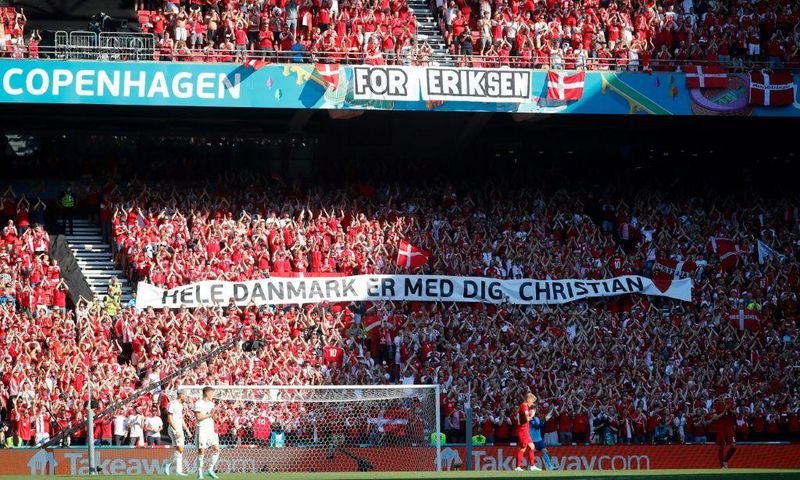 Danish supporters take part in a moment of applause for Christian Eriksen during the Euro 2020 game against Belgium
