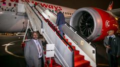 File image of President Uhuru Kenyatta boarding a Kenya Airways plane