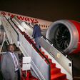 File image of President Uhuru Kenyatta boarding a Kenya Airways plane