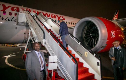File image of President Uhuru Kenyatta boarding a Kenya Airways plane