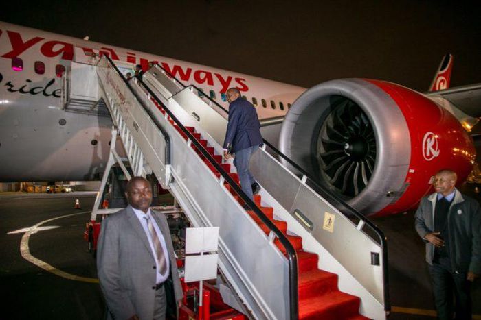 File image of President Uhuru Kenyatta boarding a Kenya Airways plane