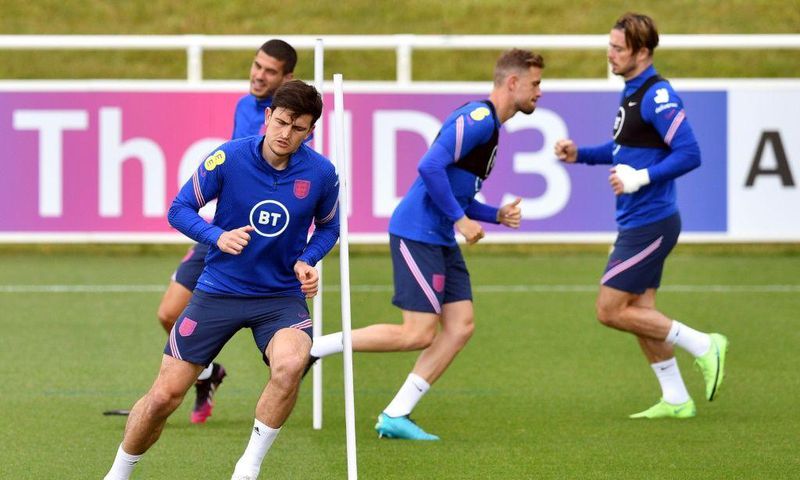 England defender Harry Maguire (left) is fit to return against Scotland