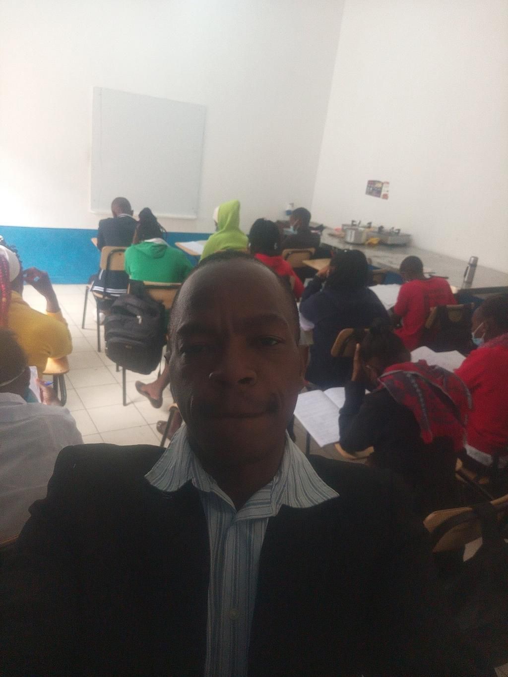 Purity Museo's stalker takes selfie with his students