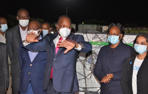 Health CS Mutahi Kagwe with other ministry officials when they received first consignment of Covid-19 vaccines at JKIA