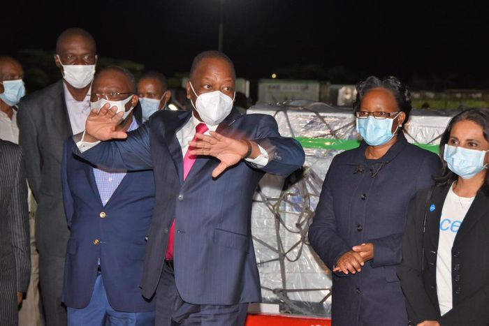 Health CS Mutahi Kagwe with other ministry officials when they received first consignment of Covid-19 vaccines at JKIA