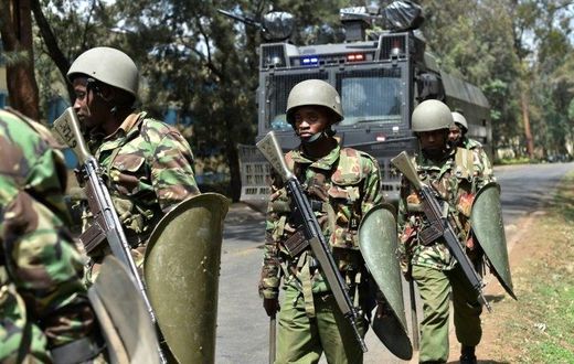 Kenyan riot police patrol a street after dispersing University of Nairobi students protesting in Nairobi on September 28, 2017