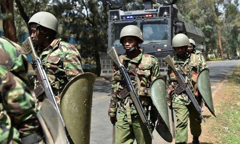Kenyan riot police patrol a street after dispersing University of Nairobi students protesting in Nairobi on September 28, 2017