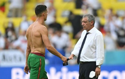 Portugal coach Fernando Santos consoles Cristiano Ronaldo after the defeat in Munich