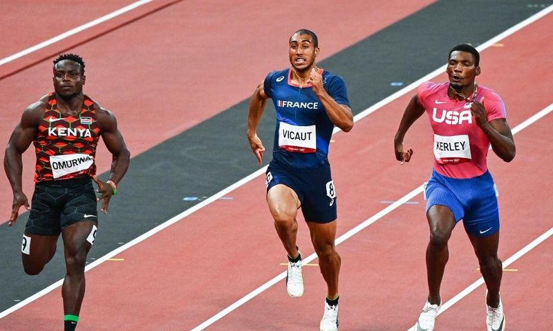 (L-R) Ferdinand OMURWA of Kenya, Jimmy VICAUT of France and Fred KERLEY of USA (100m) during athletics day three at Olympic Stadium on August 1, 2021 in Tokyo, Japan. (Photo by Anthony Dibon/Icon Sport via Getty Images)