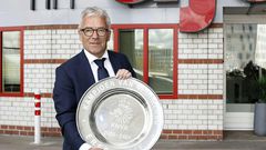 KNVB general director Eric Gudde poses with the Dutch Eredivisie trophy