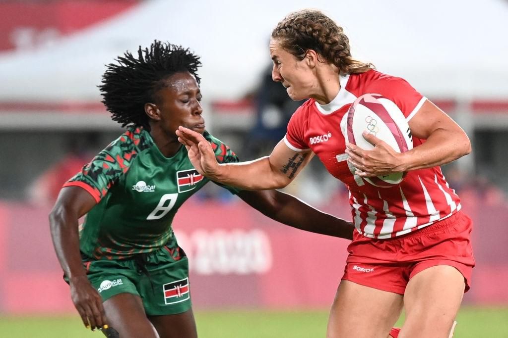 Russia's Kristina Seredina (R) fends off a tackle by Kenya's Sinaida Omondi during the women's pool A rugby sevens match between the Russia and Kenya during the Tokyo 2020 Olympic Games at the Tokyo Stadium in Tokyo on July 29, 2021. (Photo by GREG BAK...