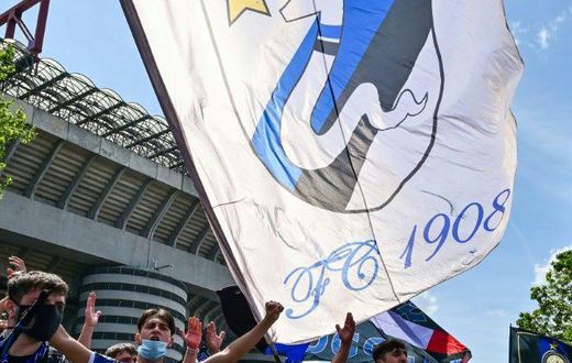 Inter Milan fans celebrate outside the San Siro.
