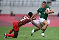 Kenya's Eden Agero (L) tries to tackle Ireland's Jordan Conroy (R) in the men's pool C rugby sevens match between Kenya and Ireland during the Tokyo 2020 Olympic Games at the Tokyo Stadium in Tokyo on July 27, 2021. (Photo by Ben STANSALL / AFP) (Photo by BEN STANSALL/AFP via Getty Images)