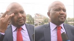Gatundu South MP Moses Kuria wiping teargas from his face
