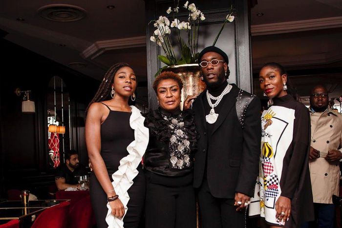 Nigerian music star Burna Boy, his mum, Bose Ogulu and his sisters [Instagram/NissiNation]