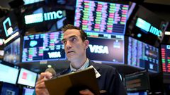 Traders at work at the New York Stock Exchange.