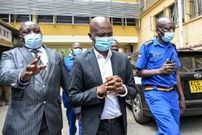 Nick Mwendwa (C), former President of Football Kenya Federation (FKF), arrives at Milimani Law Courts in Nairobi on November 15, 2021. (Photo by SIMON MAINA/AFP via Getty Images)