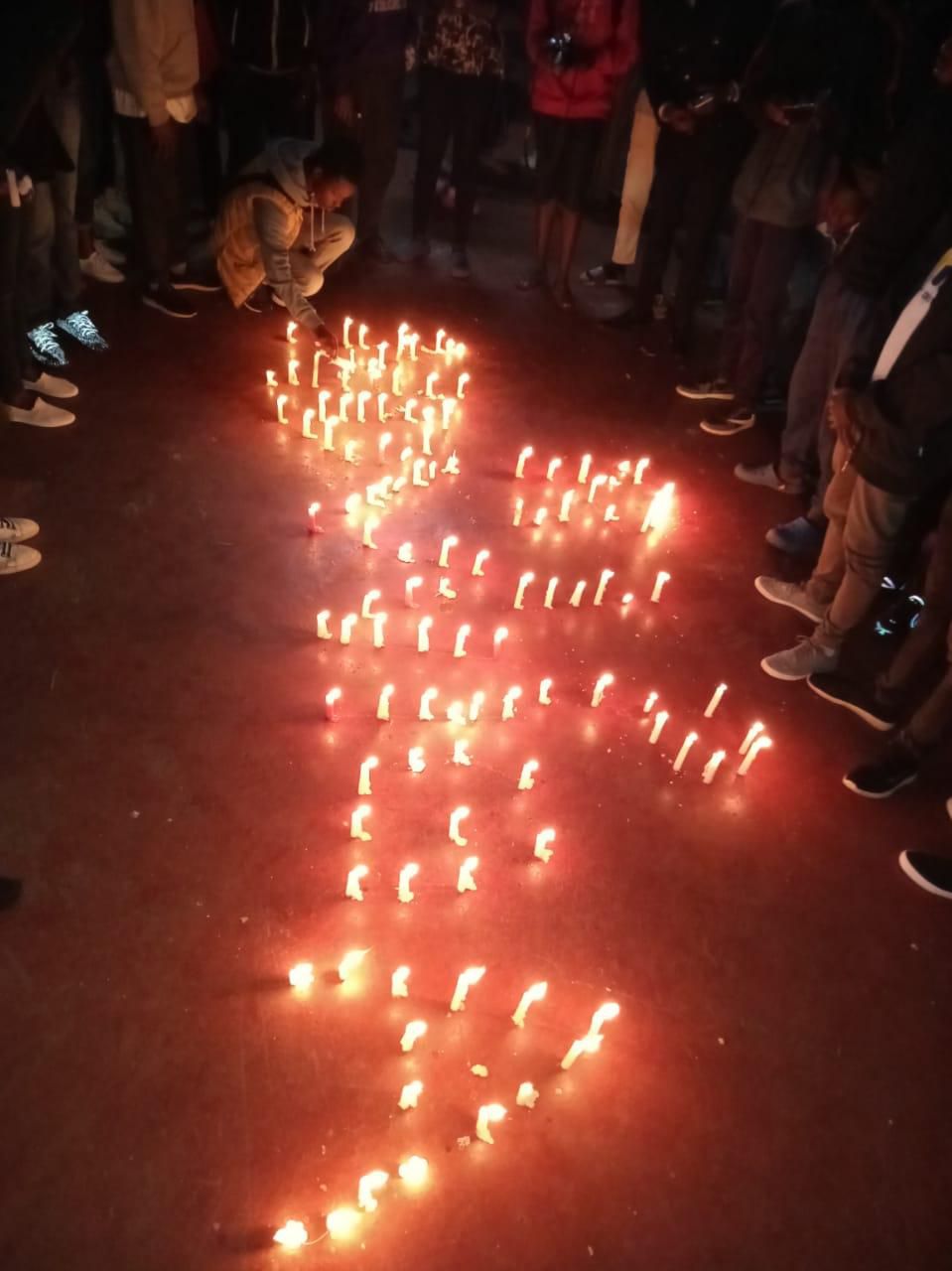Family and friends lit candles in memory of the deceased brothers