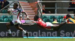 [FILE PHOTO] Carlin Isles of United States can't be caught by Nelson Oyoo of Kenya during HSBC World Rugby Sevens Series Pool C match between Kenya against United States at Twickenham stadium, London, on 2 June 2018 (Photo by Kieran Galvin/NurPhoto via Getty Images)